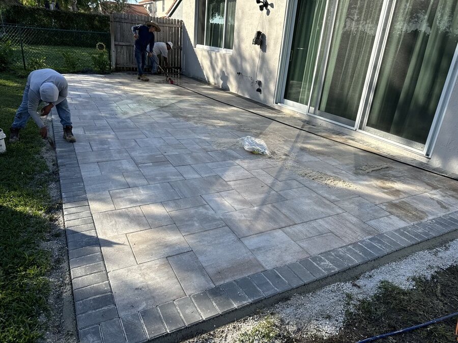 Large paver patio deck beside a home, Manny's Paver Creation